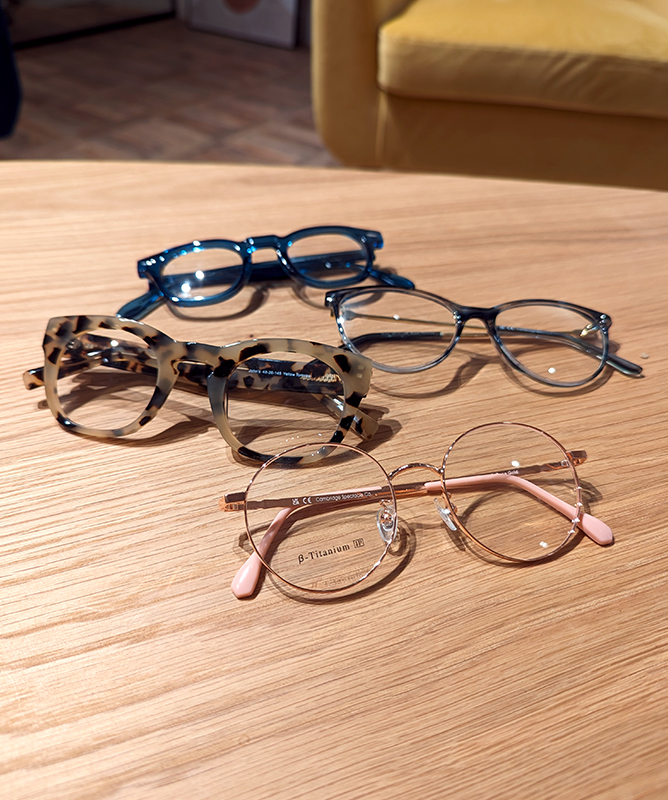 A collection of Cambridge Spectacle Co glasses on a table